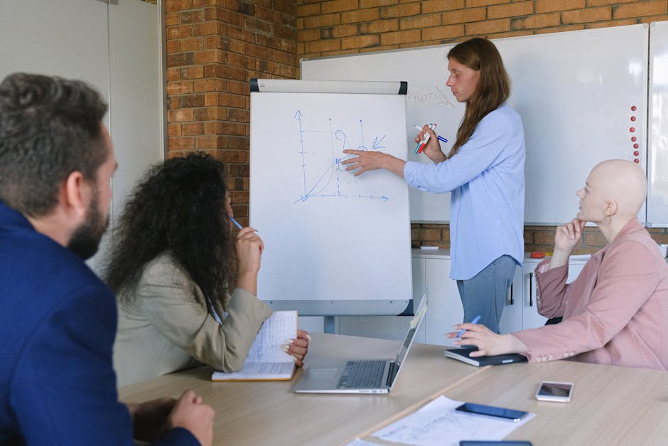 Group of businesspeople discussing and planning strategies together in a modern office setting.